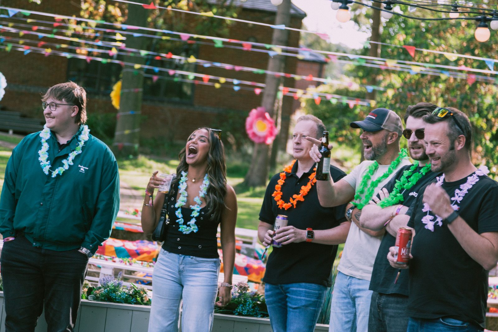Truly SMB team laughing together under the bunting