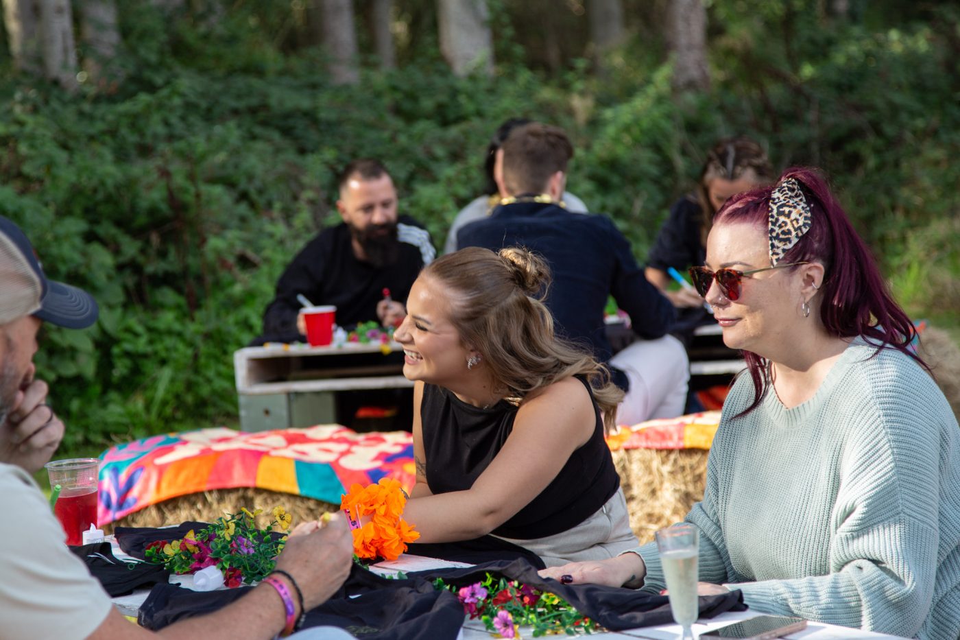 Guests chatting at the flower-lined tables