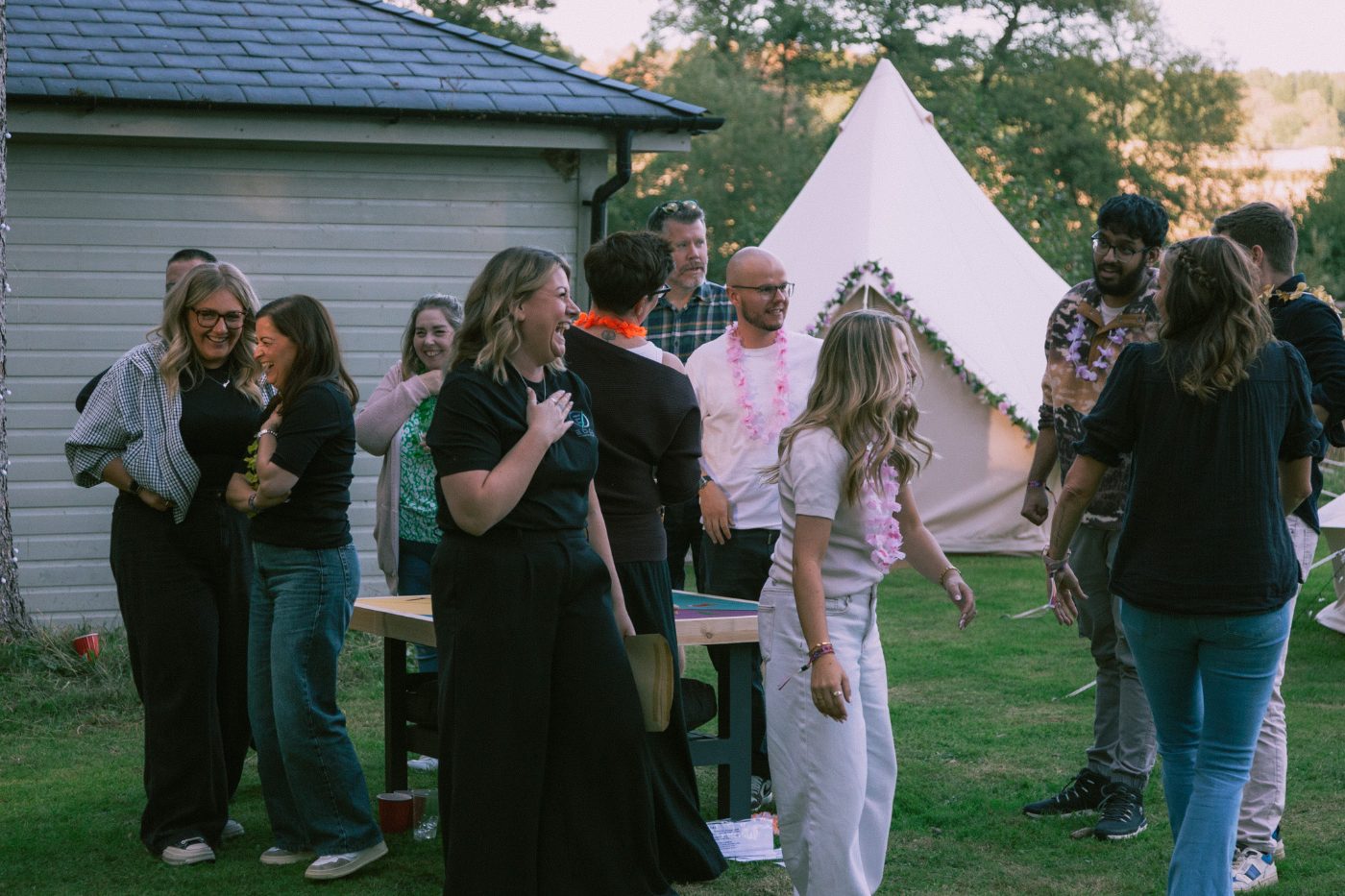 Guests mingling by the bell tents
