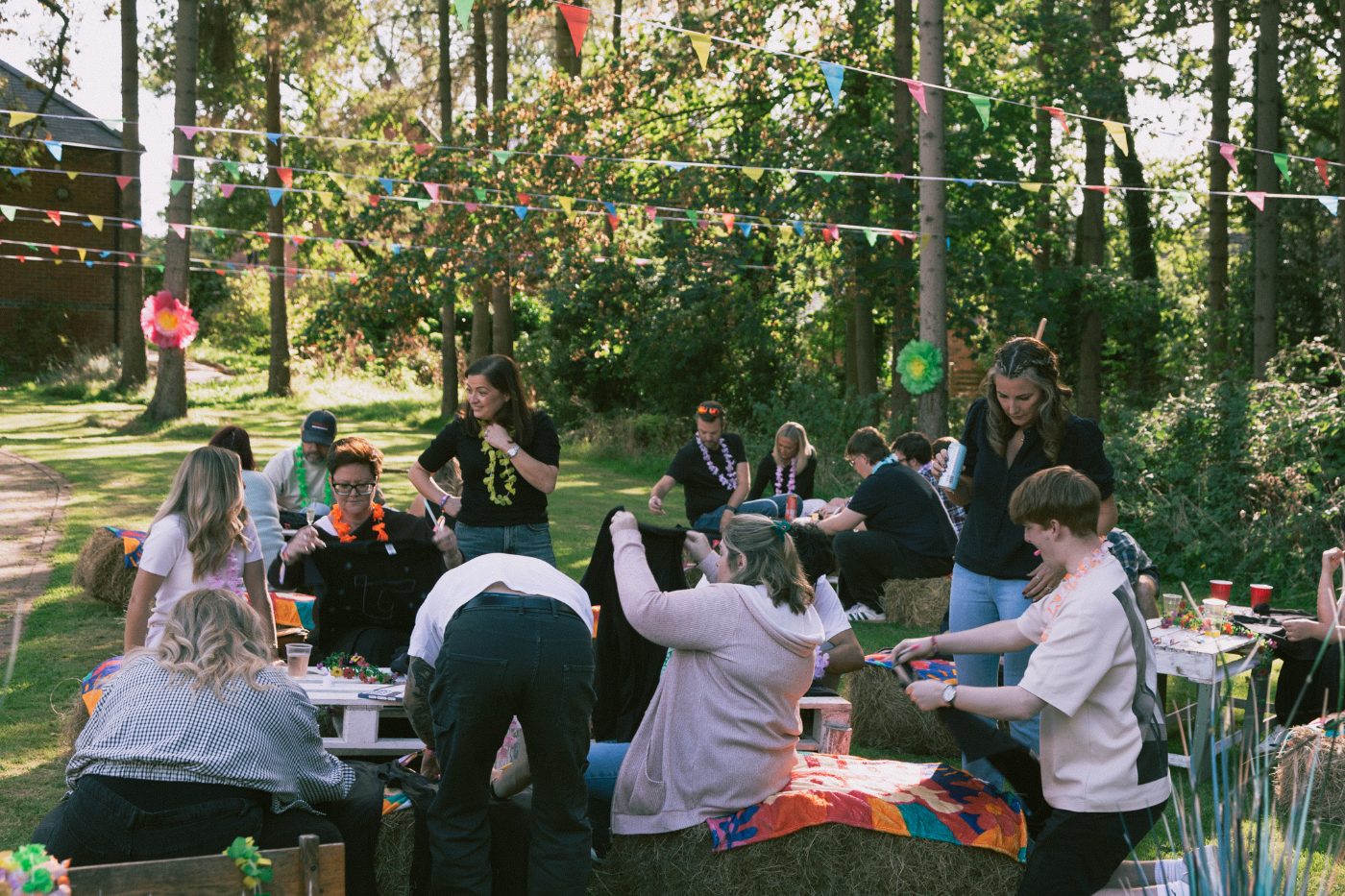 Guests gathered in the sunny garden at Truly Fest