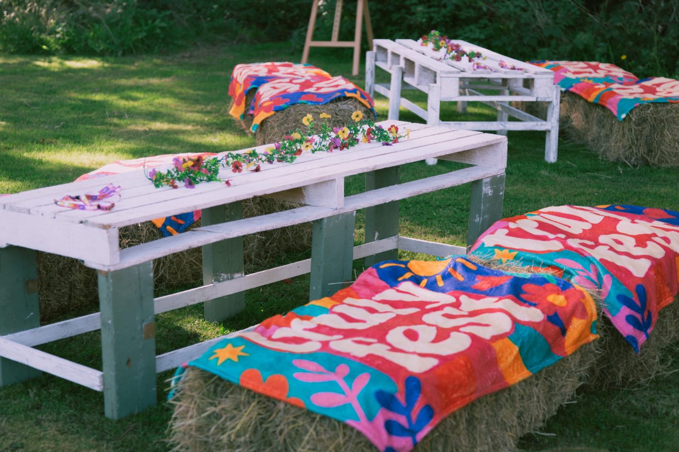 Branded throws on hay bale seating