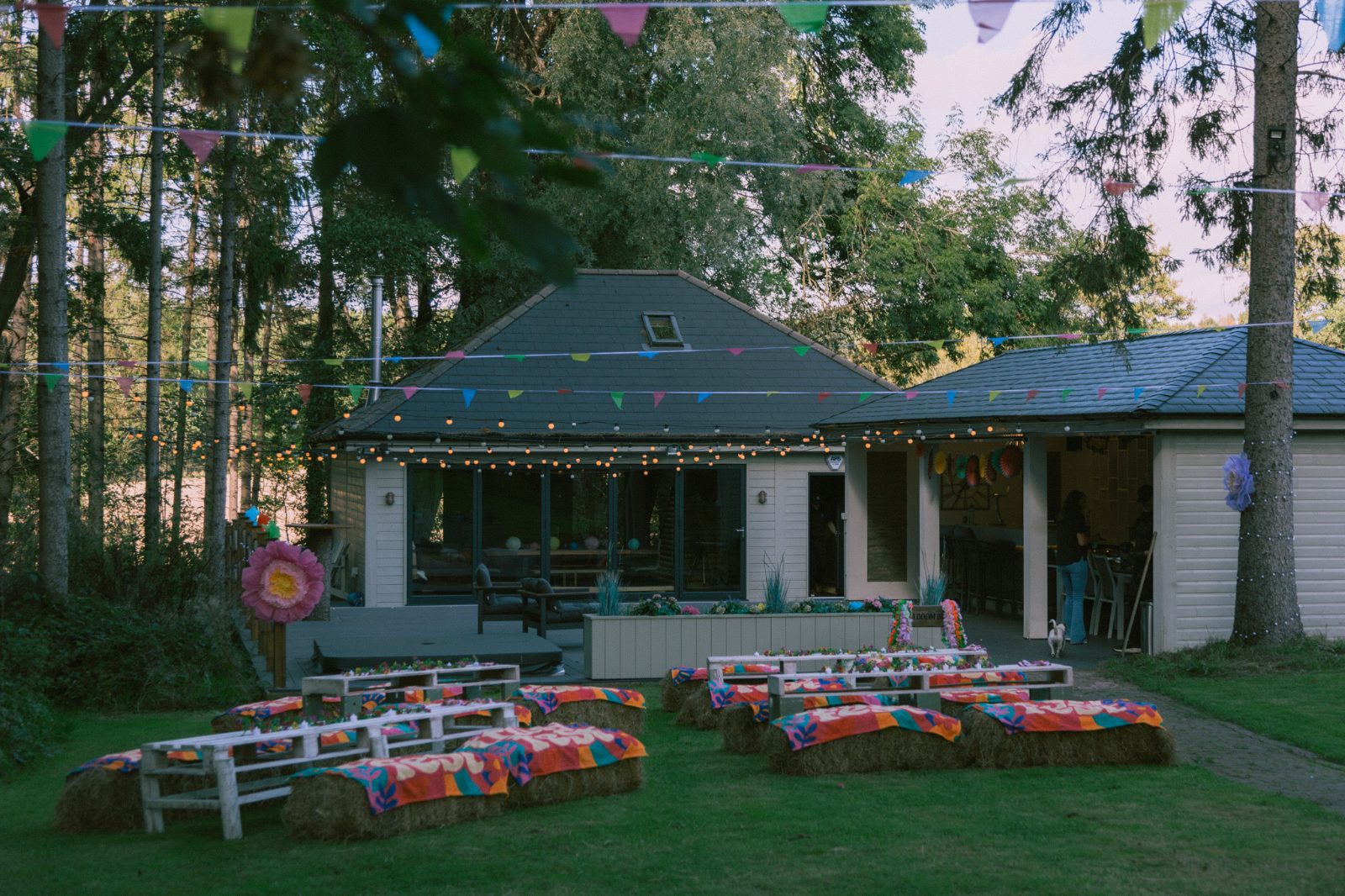 The whole site set up with hay bale seating outside the lodge